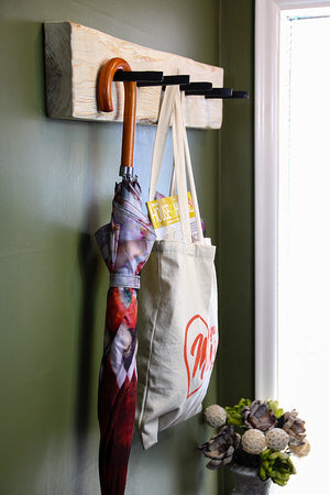 This multi coat hanger is perfect for small spaces, or to create a custom wall. Made with an authentic railway spike from the early 1900's, it can be mounted on any wall to hang coats, umbrellas, bags, hanging plants, etc. Mounting is easy - simply hang using the recess on the back. Its come with  a set of screws and plugs