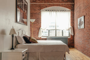 Modern Design - image of modern loft style bedroom with brick wall